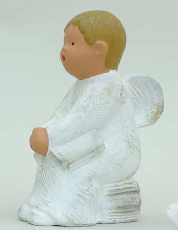 Singer Angel - Ibo sitting on stack of books - 14 cm