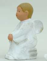 Singer Angel - Ibo sitting on stack of books - 14 cm